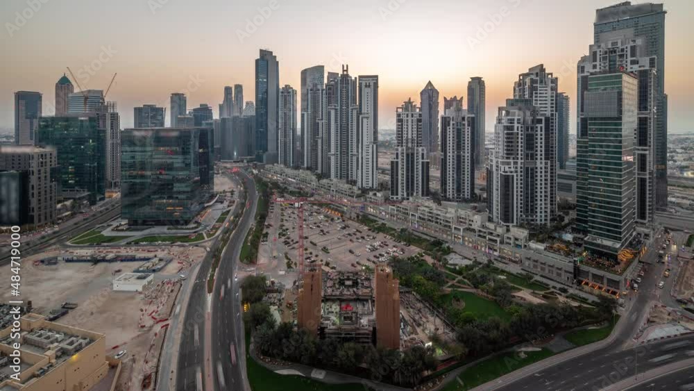 Bay Avenue with modern towers residential development in Business Bay aerial panoramic day to night timelapse, Dubai Bay Avenue with modern towers residential development in Business Bay aerial panoramic day to night timelapse, Dubai