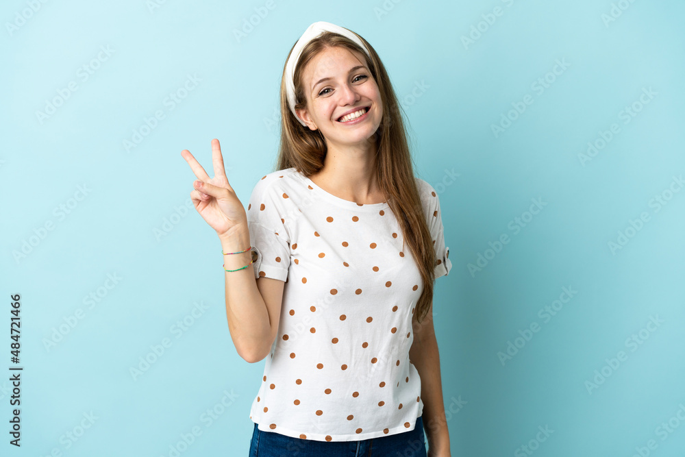 Young caucasian woman over isolated background smiling and showing victory sign Young caucasian woman over isolated background smiling and showing victory sign