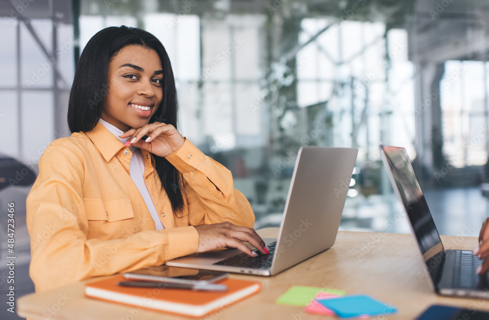 Business women working on laptops in office Business women working on laptops in office