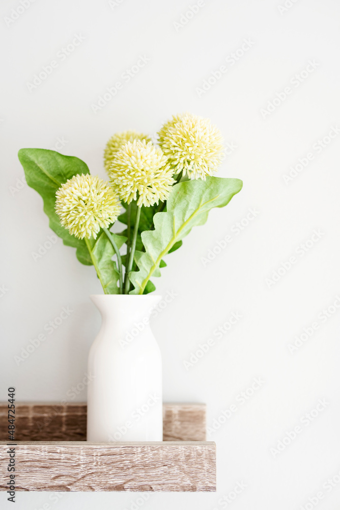 Light Green Dianthus in a White Vase in a Bright and Airy Home Light Green Dianthus in a White Vase in a Bright and Airy Home