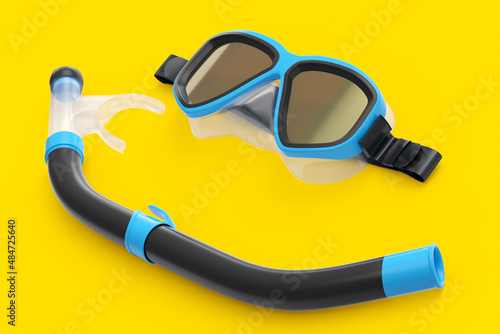 Blue diving mask and snorkel isolated on a yellow background