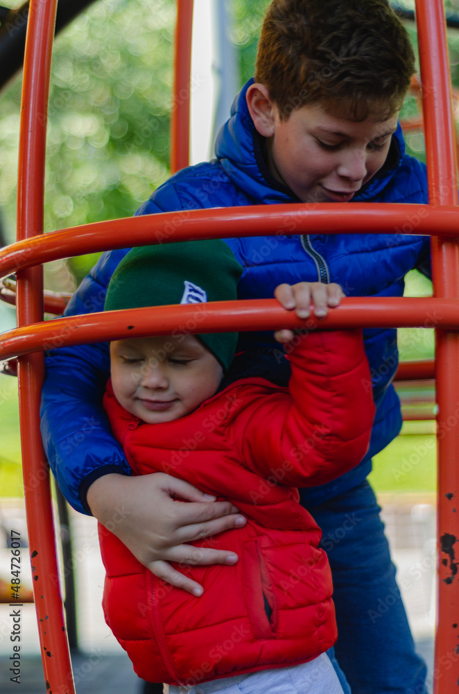 brothers play in the playground, free space brothers play in the playground, free space