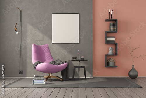 Relaxation room with pink armchair and little bookcase