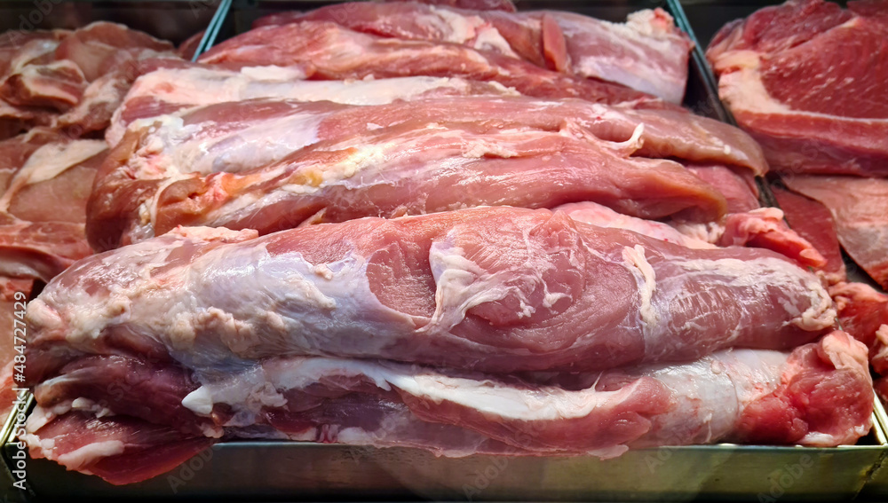 Raw pork fillet in the butcher shop