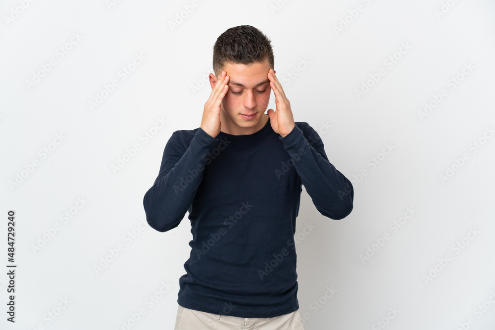 Young caucasian man isolated on white background with headache Young caucasian man isolated on white background with headache