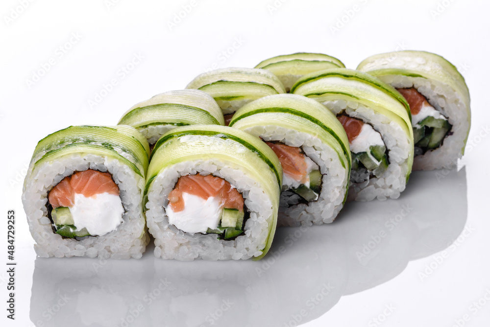 Traditional delicious fresh sushi roll set on a white background Traditional delicious fresh sushi roll set on a white background