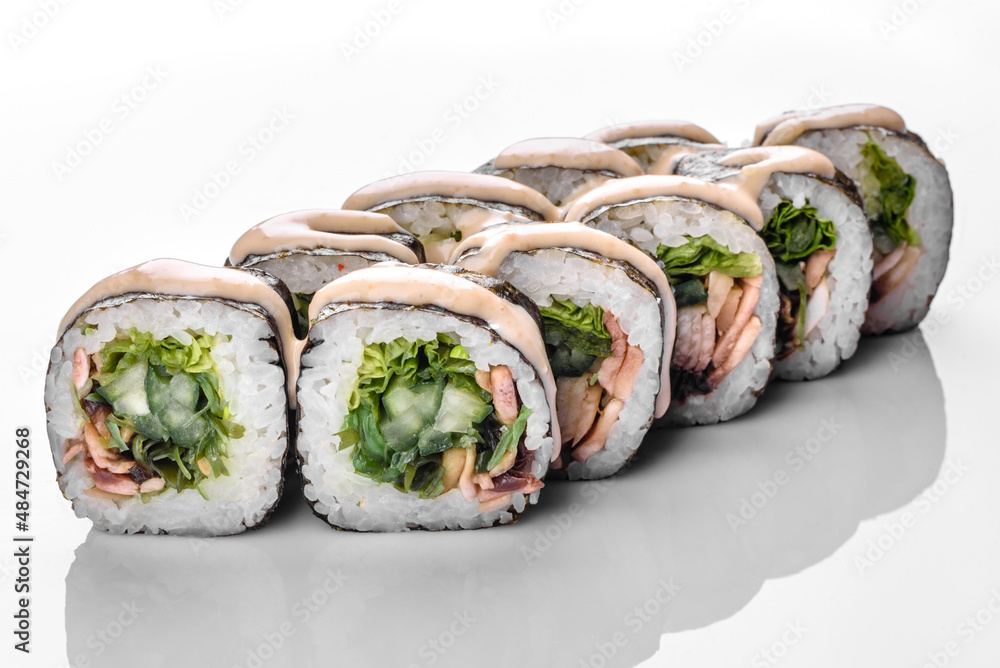Traditional delicious fresh sushi roll set on a white background Traditional delicious fresh sushi roll set on a white background