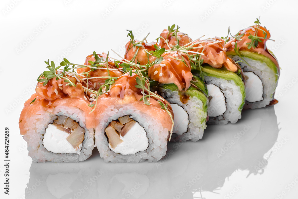 Traditional delicious fresh sushi roll set on a white background Traditional delicious fresh sushi roll set on a white background