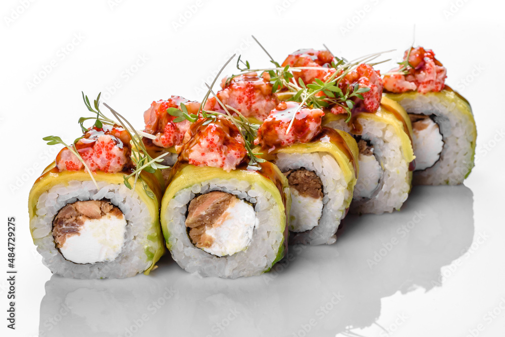 Traditional delicious fresh sushi roll set on a white background Traditional delicious fresh sushi roll set on a white background