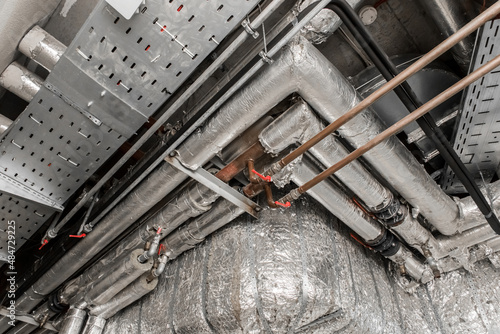Ventilation air conditioning system in thermal insulation material duct pipe hvac pipeline on the ceiling of an industrial plant