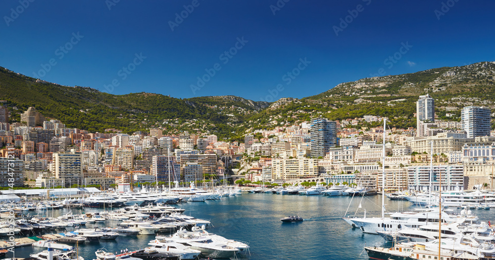Aerial view of port Hercules in Monaco - Monte-Carlo at sunny day, a lot of yachts and boats are moored in marina, mediterranean sea