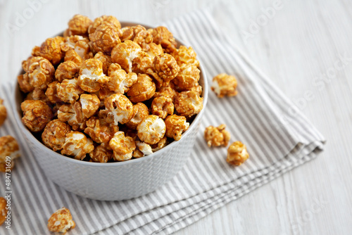 Homemade Caramel Popcorn in a gray Bowl, low angle view. Copy space.