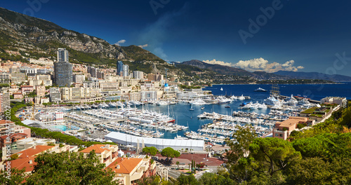 Aerial view of port Hercules in Monaco - Monte-Carlo at sunny day, a lot of yachts and boats are moored in marina, mediterranean sea © Vladimir Drozdin