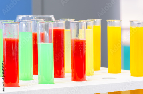 Scientist working with chemical reaction in chemistry laboratory. close up of scientist making research in lab  chemical molecular on blue chemistry science laboratory background