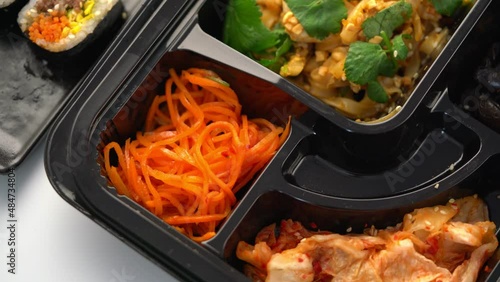 A set of Korean food in a container. Korean cuisine. Asian Lunches