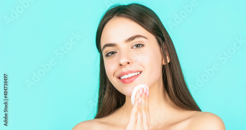 Concept of beauty  health treatment. Cosmetology and spa. Using makeup sponge. Portrait woman using sponge. Beautiful brunette woman with clean perfect fresh skin using cotton pad skin care concept