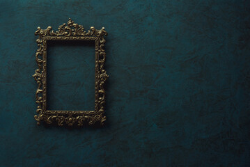 Vintage openwork bronze metal frame on a old wall background