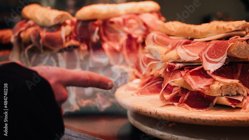 Ham sandwiches indicated by a hand photo