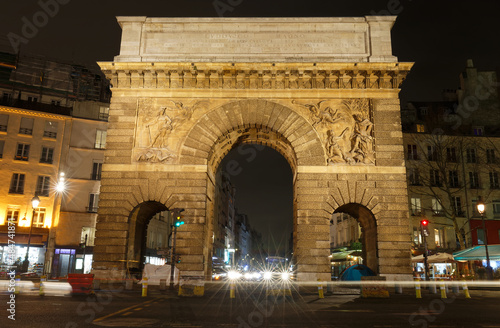 Paris, the porte Saint-Martin, beautiful ancient gate near the Grands Boulevards at night. © kovalenkovpetr