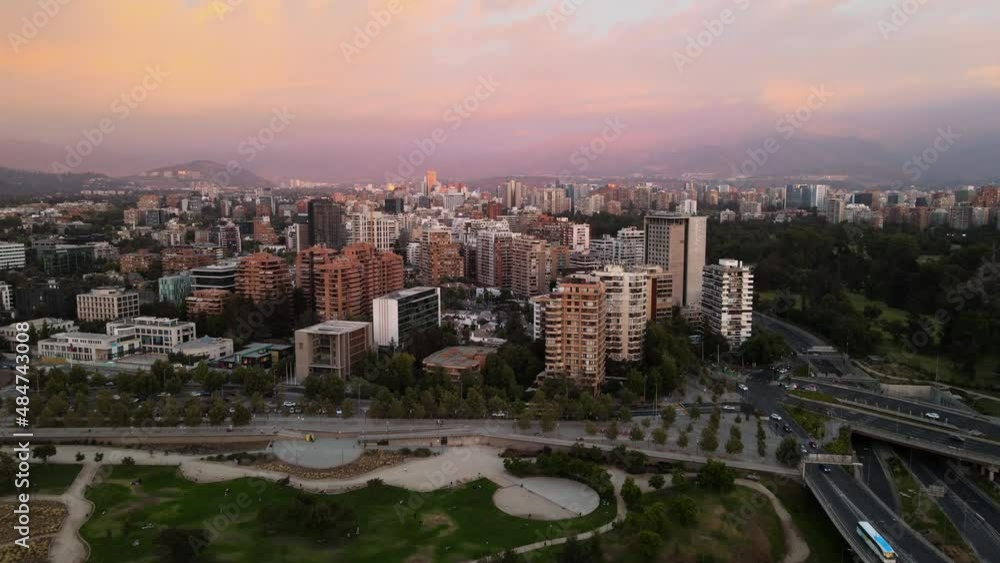 Aerial dolly in of Bicentenario Park and Vitacura neighborhood buildings at sunset, Santiago, Chile Aerial dolly in of Bicentenario Park and Vitacura neighborhood buildings at sunset, Santiago, Chile