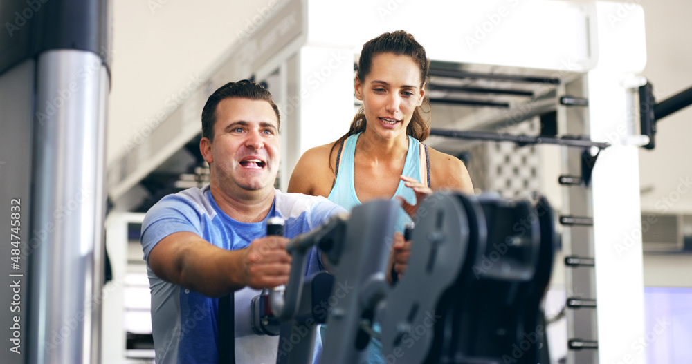 Give me a few more. Cropped shot of a female fitness instructor taking her male client through a workout in the gym. Give me a few more. Cropped shot of a female fitness instructor taking her male client through a workout in the gym.