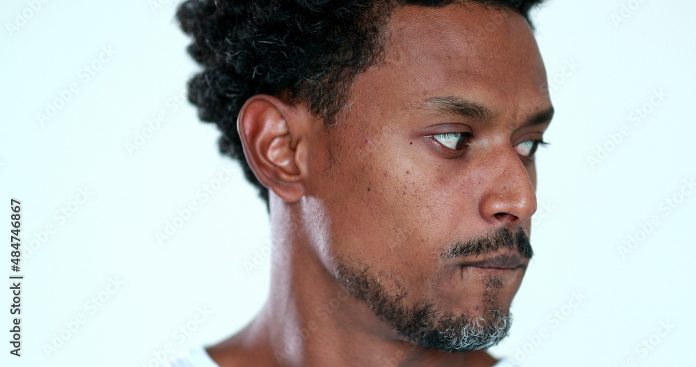 Portrait of anxious black guy looking to camera feeling restless and doubtful