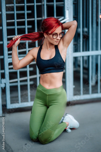 Portrait of fit and attractive fitness woman working out © aboutmomentsimages