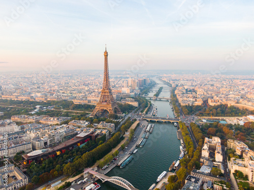 Establishing Aerial view of Paris Cityscape with Eiffel Tower and Seine river on sunrise, France. Landmark Monument as Famous Touristic Destination. Romantic Travel and Urban Skyline Panorama © OPEN FILMS