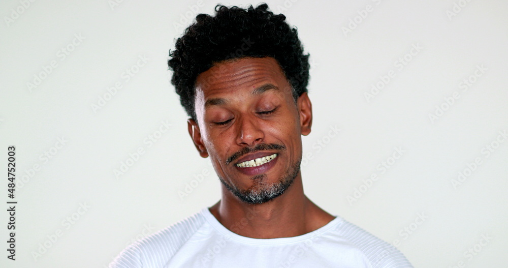 Pensive African american man thinking, expressive face. Thoughtful black guy reaction agreeing Pensive African american man thinking, expressive face. Thoughtful black guy reaction agreeing