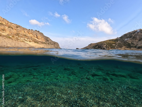 Underwater split photo of paradise beach of Melidoni in island of Kythira, Ionian sea, Greece