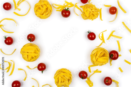 Fototapeta Naklejka Na Ścianę i Meble -  Flat lay of italian pasta Tagliatelle or Fettuccine with cherry tomatoes on white background, top view. Copy space. Cooking frame