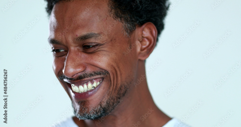 Fototapeta premium Black guy portrait smiling and laughing, authentic real life smile african person