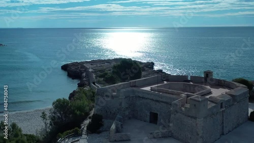 Playa y Castillo de Sant Jordi d'Alfama en l'Ametlla de Mar Tarragona Spain photo