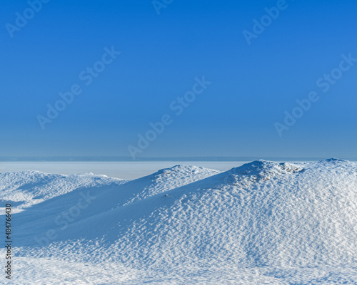 frozen desert with snow mountains with clear day