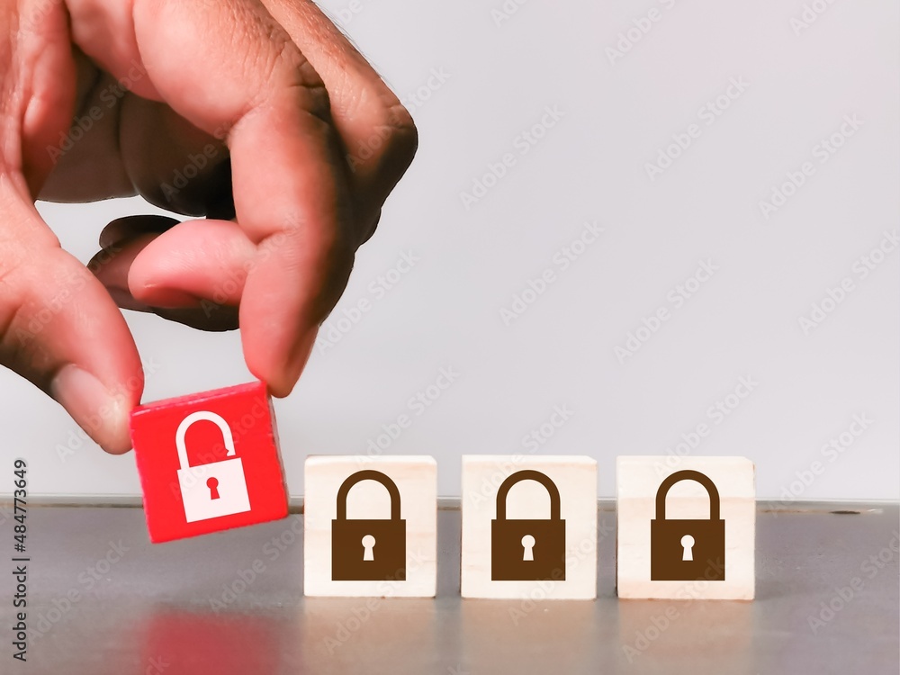 Man pick unlock icon among lock icons. Business strategy and plan concept. Man pick unlock icon among lock icons. Business strategy and plan concept.