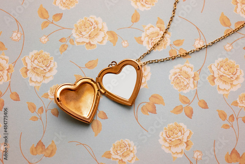 Gold Heart Reliquary over a Floral Vintage Background
