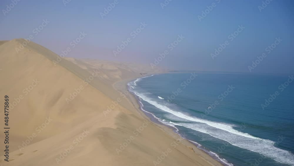 Sandwich Harbour in Namibia at the coast of the Atlantic Ocean. Sandy beach.
