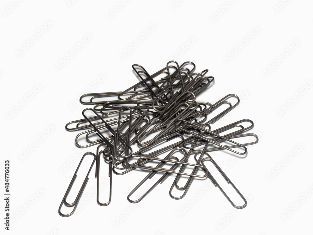 Large paper clips on a white background. Office supplies isolate. Paper fastening. Paper clips. Large paper clips on a white background. Office supplies isolate. Paper fastening. Paper clips.