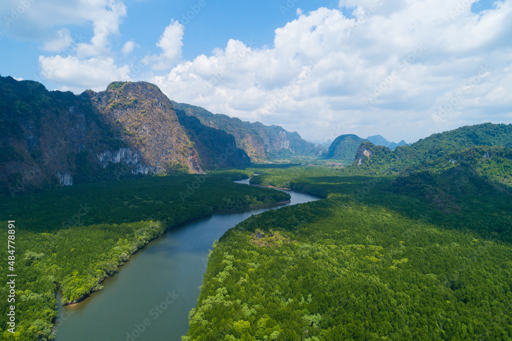 Aerial view drone shot of beautiful natural scenery river in mangrove forest and high mountains in phang nga province Thailand