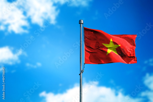 Flags of Vietnam on the wind against blue sky