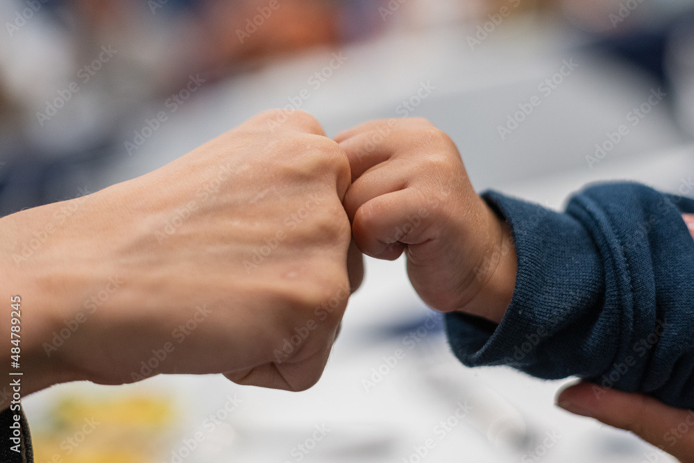 Fototapeta premium handshake of child and adult person