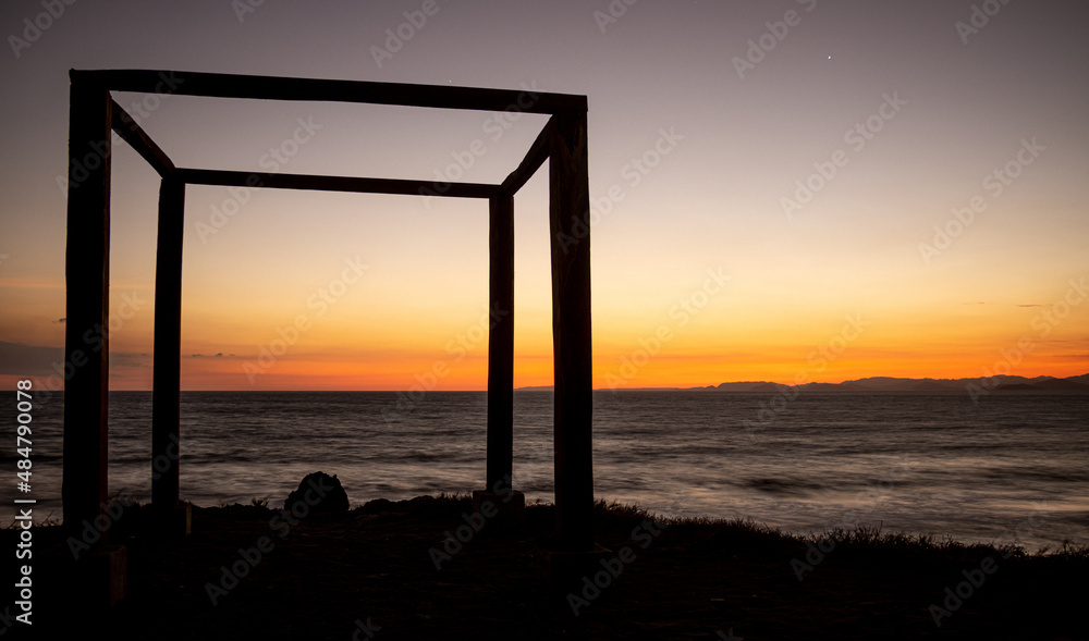 Fototapeta premium Sunset on the beach, shadows, copy space, blur, stars, starry night, blue, red, orange, mindfulness, meditation, landscape, peace, solitude, reflect, meditate, meditate, being alone thinking, freedom,