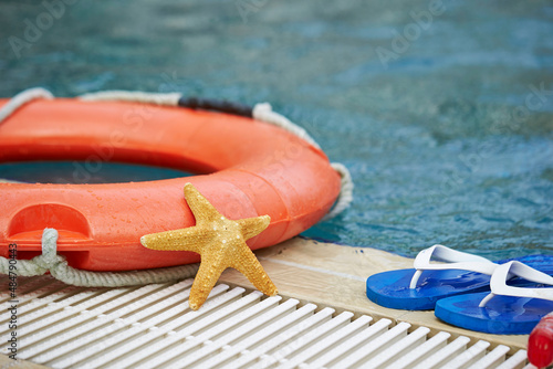 Lifebuoy and starfish in the swimming pool