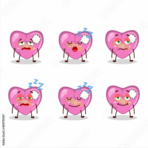 Cartoon character of pink broken heart love with sleepy expression