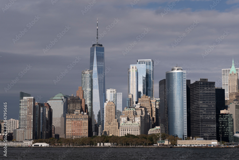 Manhattan's skyline with cloudy sky at sunset