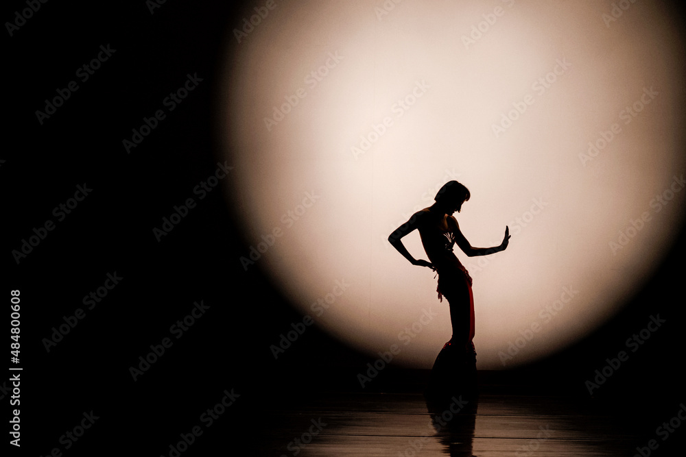 Dance silhouette under moonlight