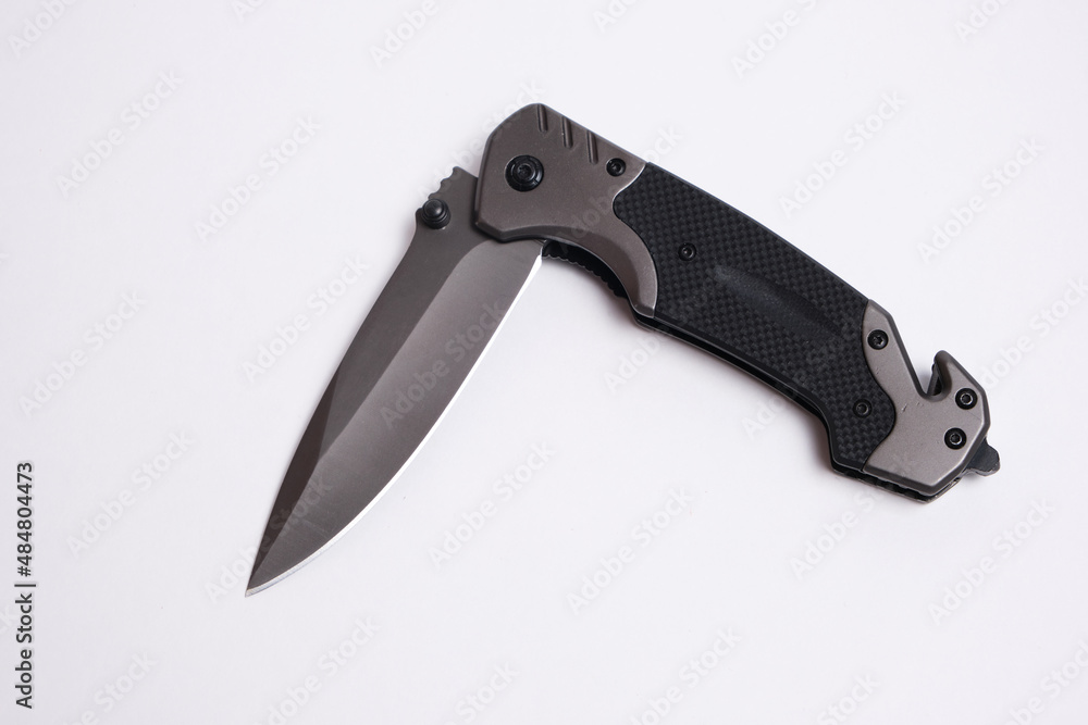 Tactical folding knife on white background, isolated. Tactical folding knife on white background, isolated.