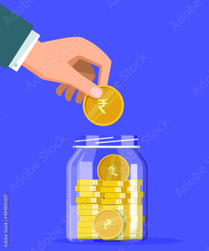 Man putting rupee coin in glass jar for investing purpose, saving rupee coin in jar, growth, income, saving, investment, for good return.