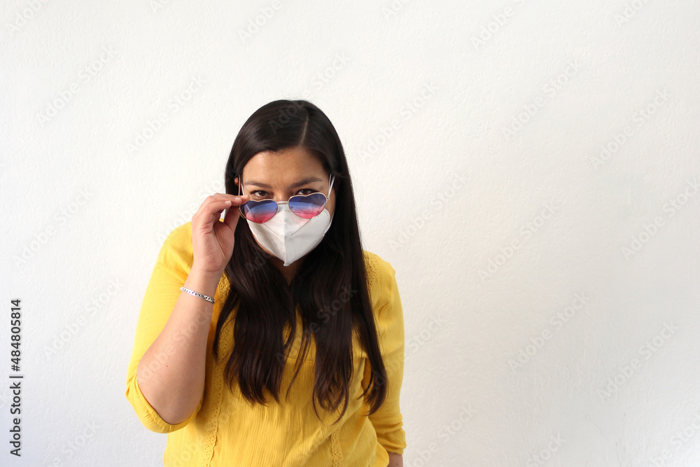 Latin adult woman with face mask and heart-shaped glasses excited for February Valentine's Day of Love and Friendship in the new normality due to the Covid-19 pandemic
Latin adult woman with face mask and heart-shaped glasses excited for February Valentine's Day of Love and Friendship in the new normality due to the Covid-19 pandemic