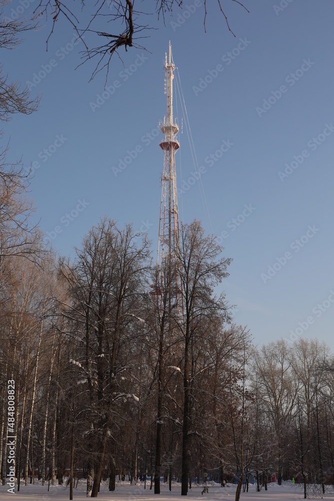 high TV tower on the background of blue sky